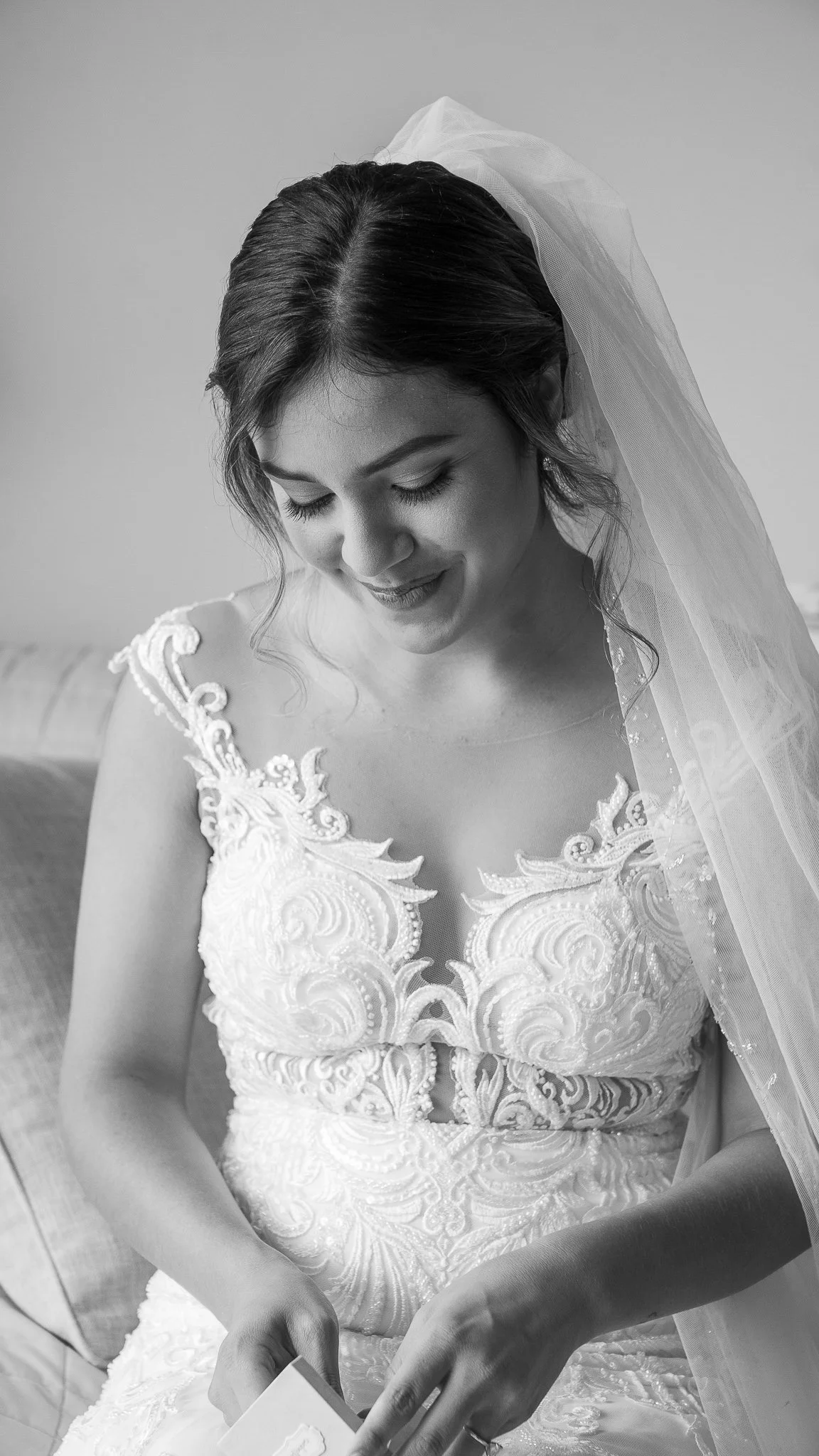 Black-and-white bridal portrait photographed in a documentary style. 