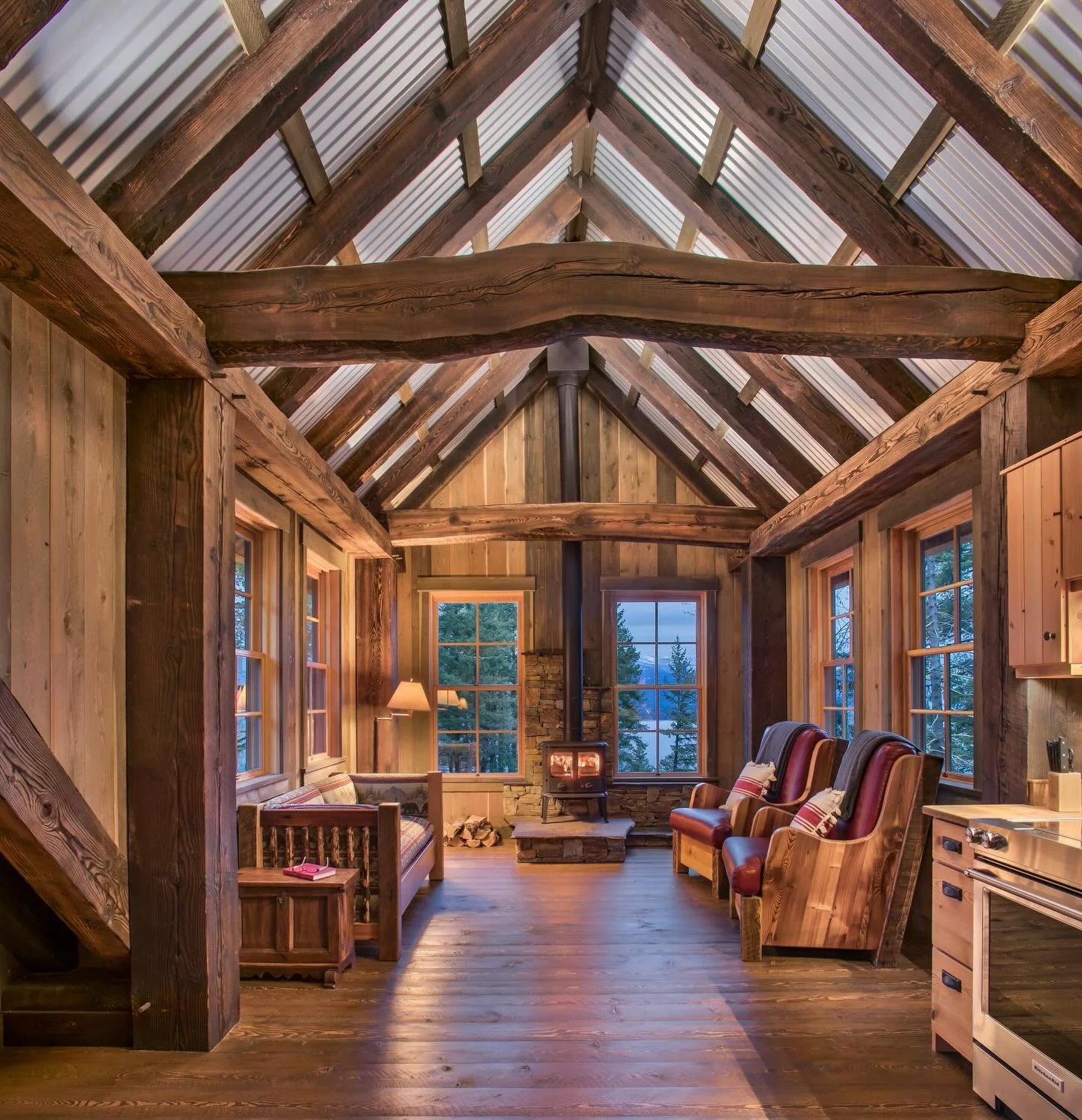 American Wabi-Sabi⠀
⠀
Circle-sawn and burned, hand-selected arched timbers frame this mining-inspired cabin overlooking Lake Pend Oreille. ⠀
⠀
Reclaimed Douglas fir kitchen from early Sandpoint buildings. ⠀
⠀
Grey patinas on the wall panelling create