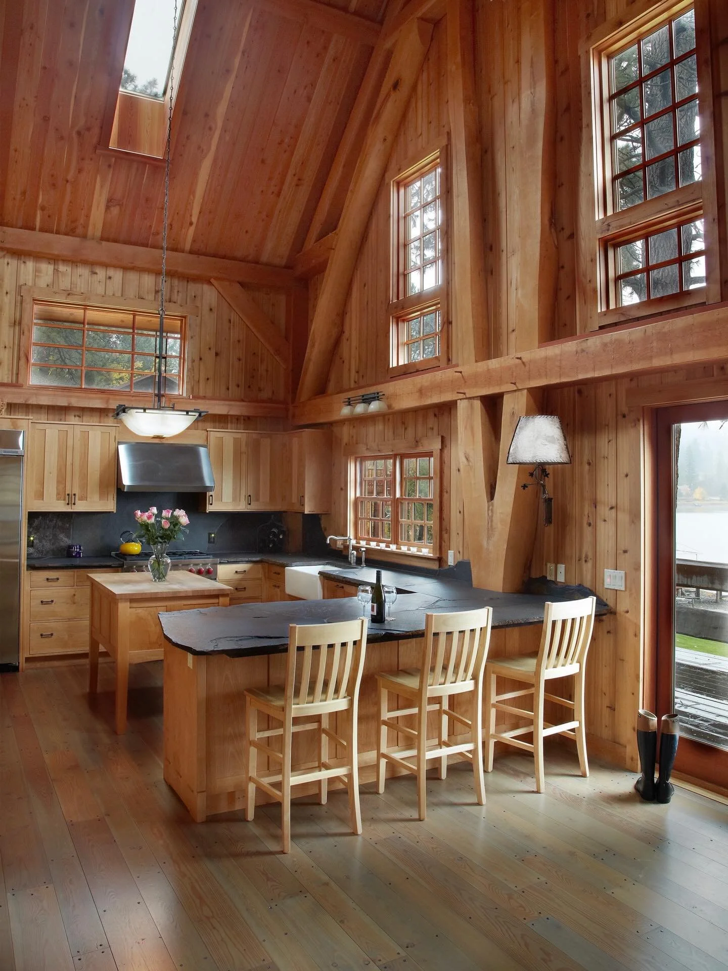 For the past 22 years, we&rsquo;ve been working with my local forests to create spaces that embody the beauty of our region and celebrate our 1,000-year craft lineage.⠀
⠀
Scribed birch bifurcation and jambe de force, leg of strength overlooking lake 