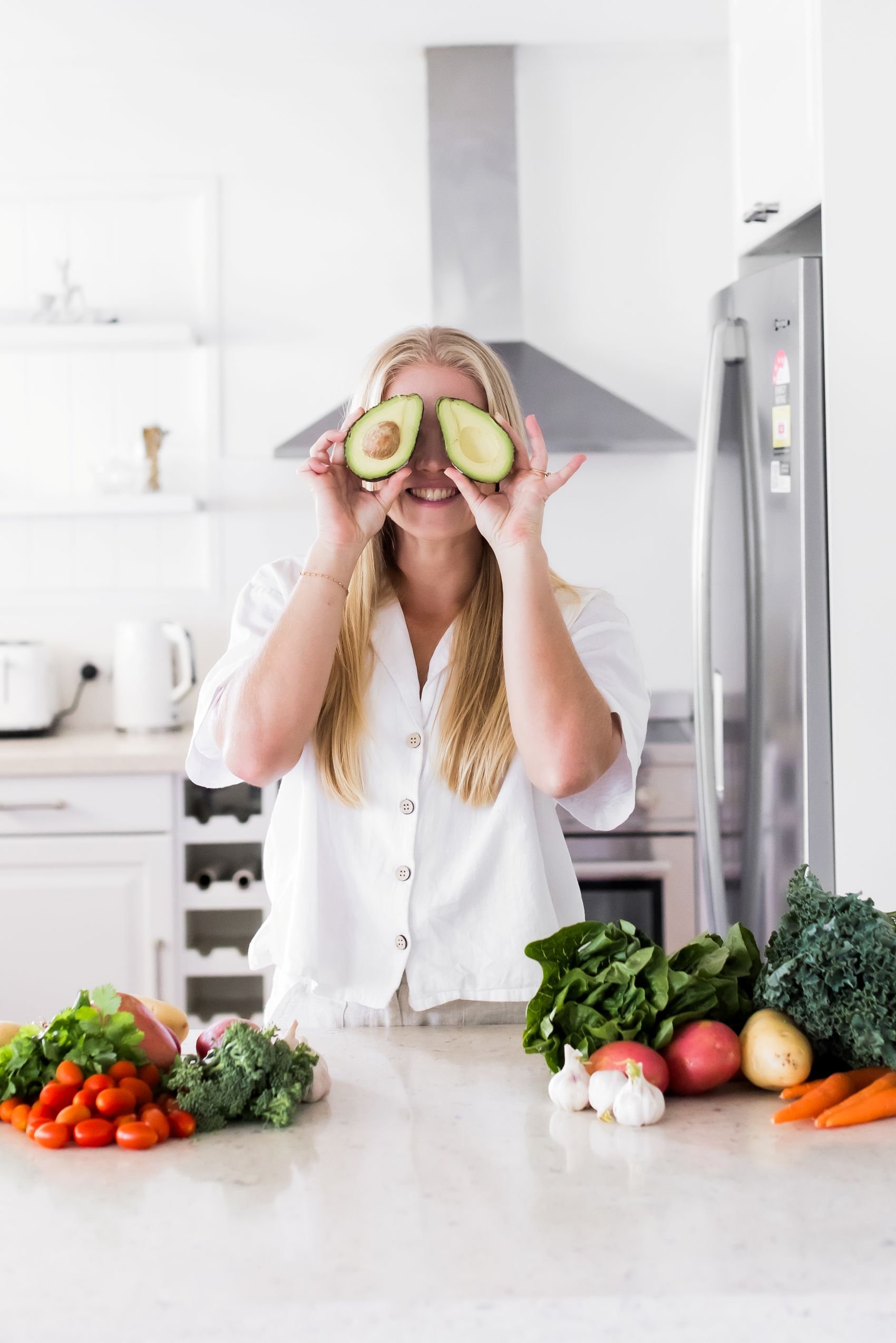 sunshine coast dietitian holding avocado over eyes