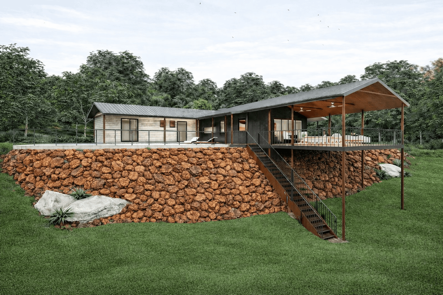 Modern house built on a raised stone foundation with a metal staircase leading up to a large porch, surrounded by a lawn and trees.