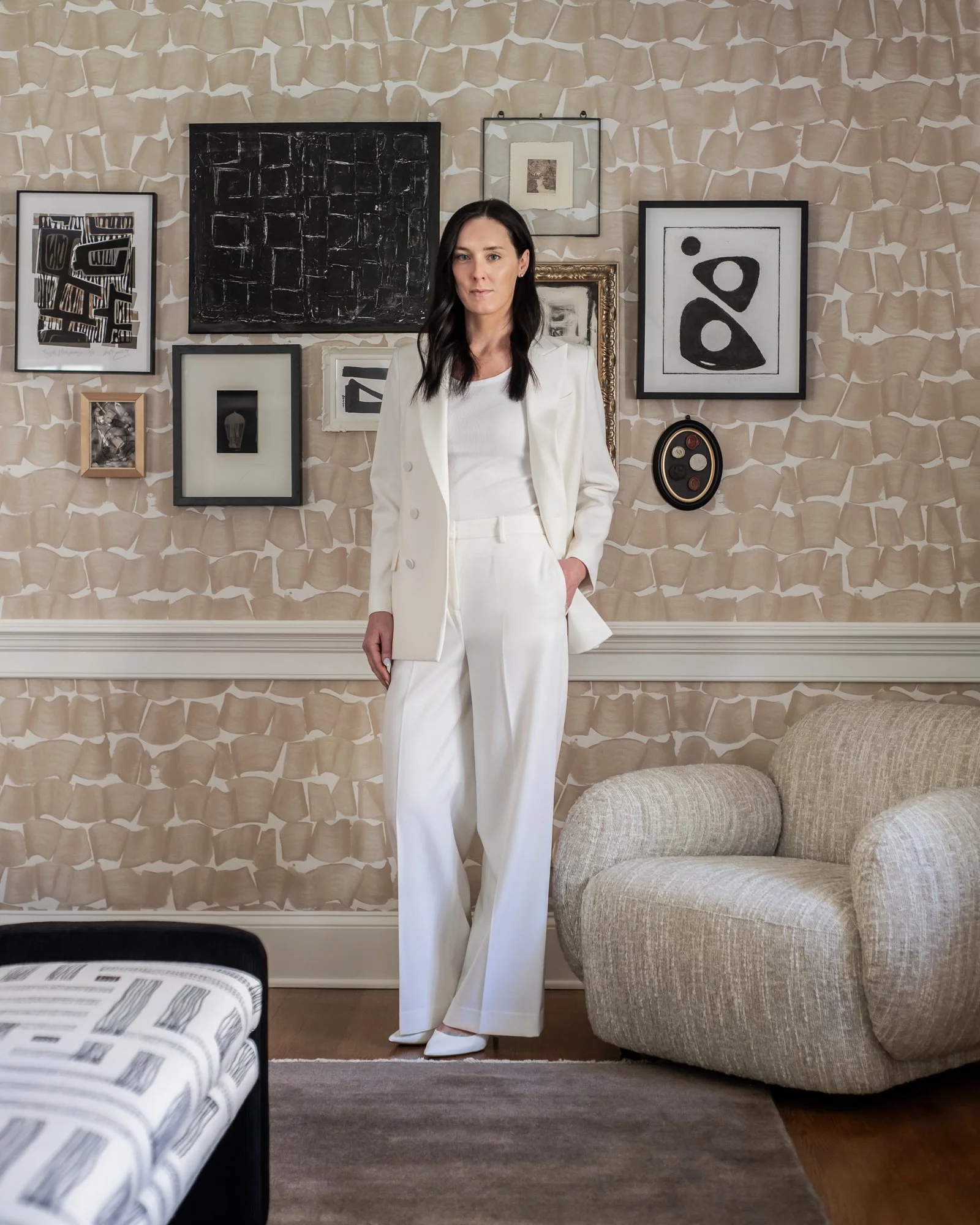 Chatham, NJ interior designer in front of custom gallery wall in Chester, NJ