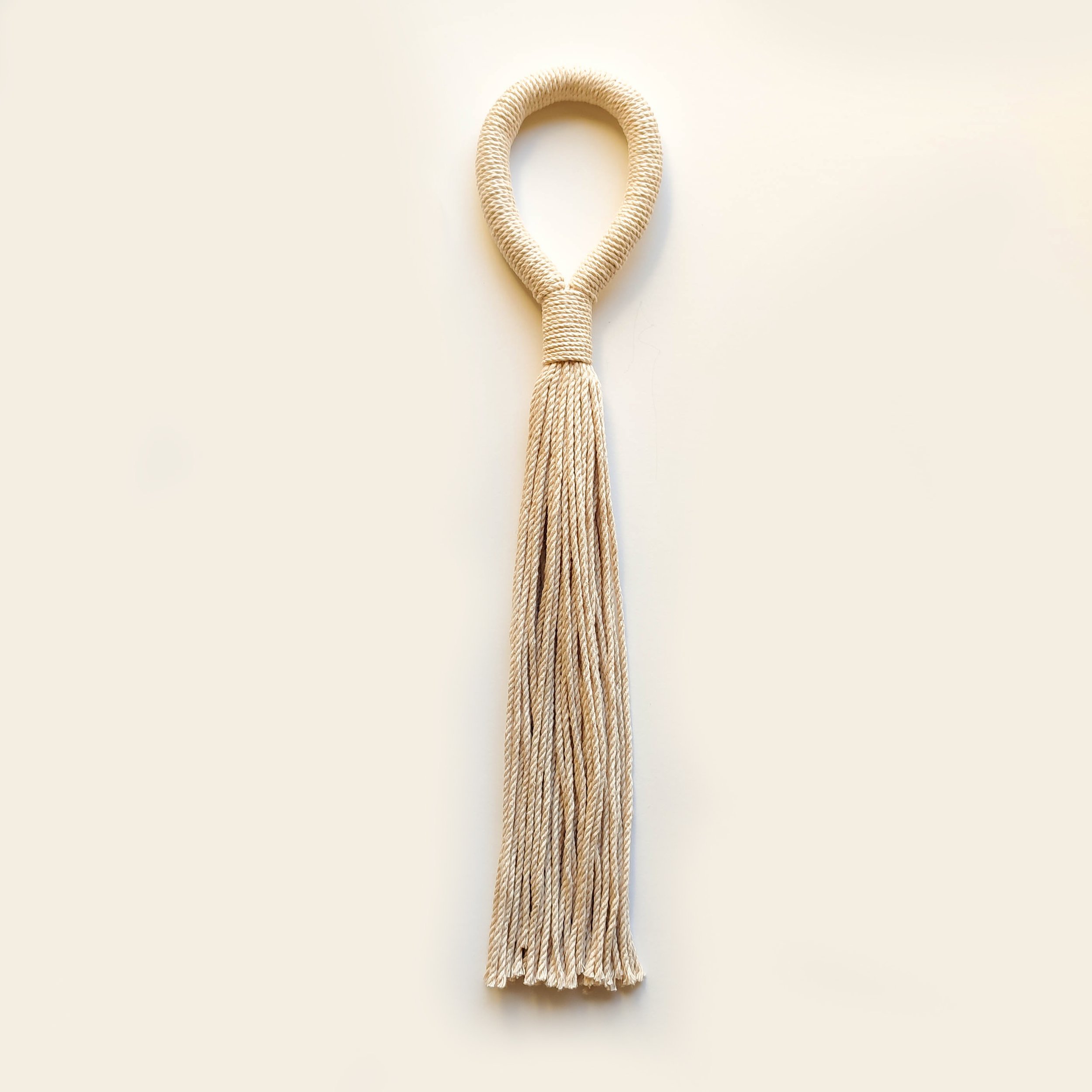 White plain or beaded loop tassel