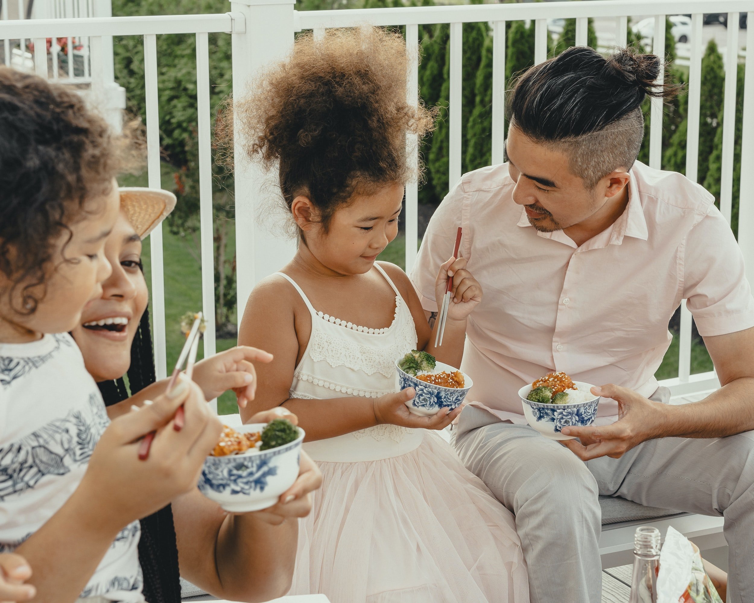 Family enjoying food. Parenting support in Kitchener-Waterloo