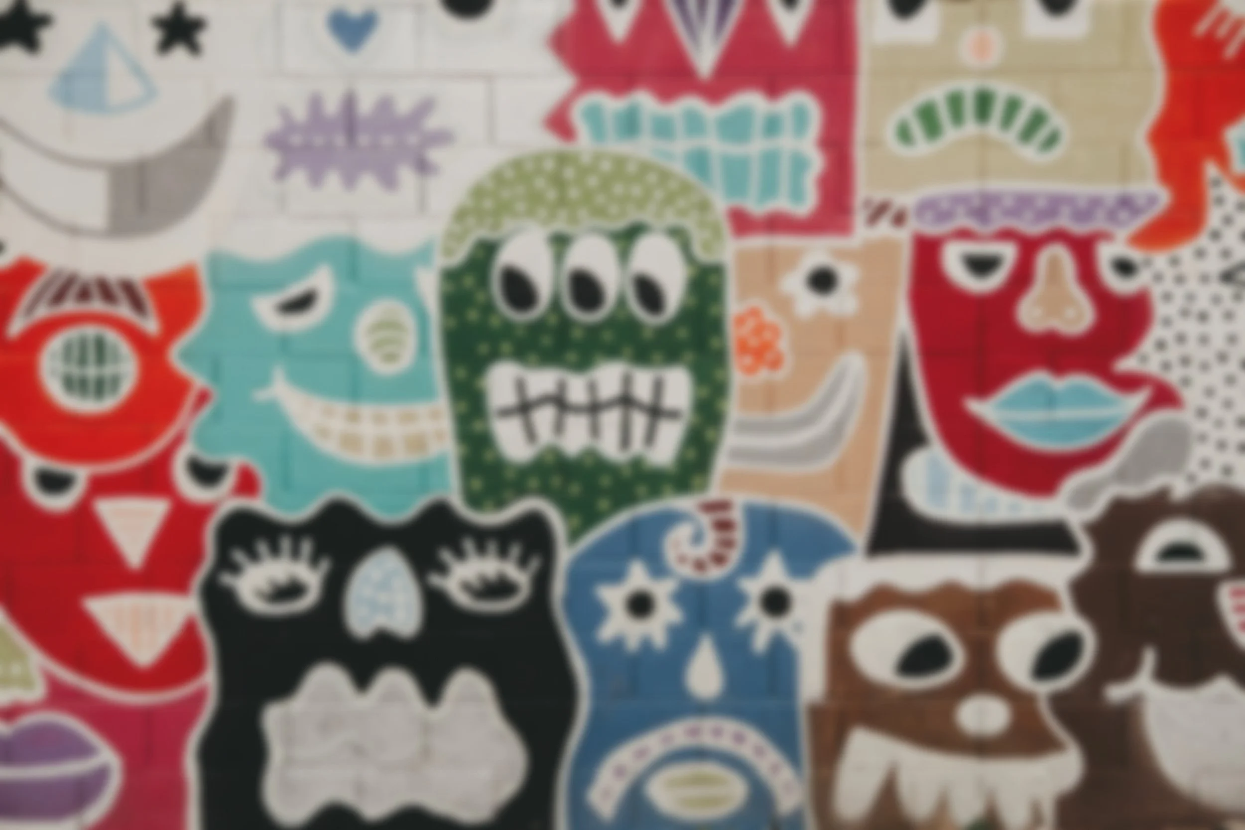 Mosaic of monster faces representing child therapy in Kitchener-Waterloo