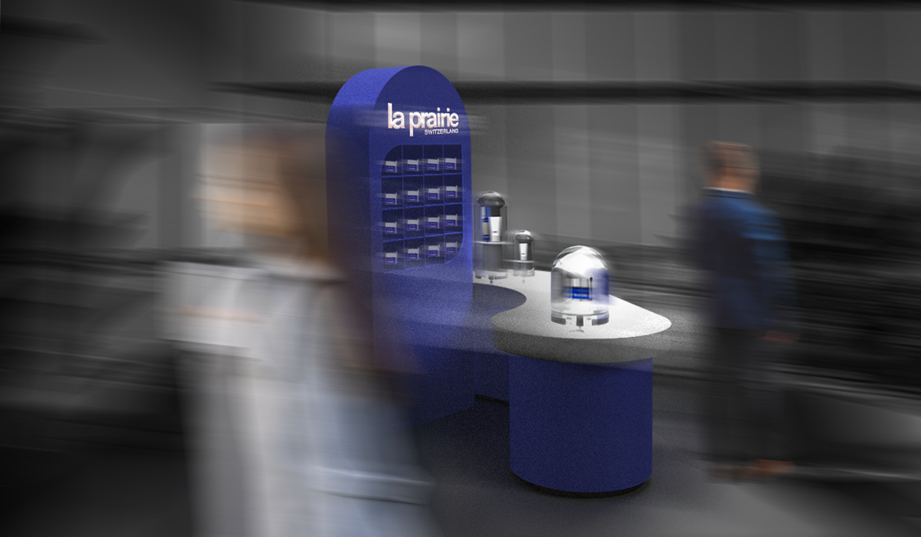 Blue La Prairie Switzerland promotional display with skincare products at a convention or exhibition.