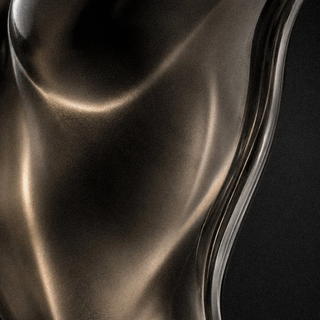 Close-up of a frosted glass surface with smooth curves and a polished finish. Perfume bottle for Jean Paul Gaultier. Architecture and Design by Auliseo (Aurèle Eliseo Stauffer).