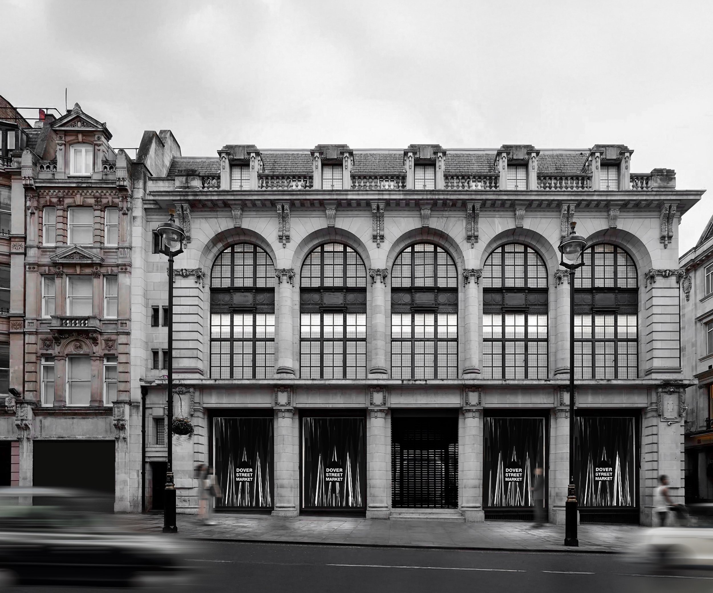 Black and white photo of a building with arches, large windows, decorative columns. Signage on the building reads 'Dover Street Market'.
DOVER STREET MARKET LONDON storefront, steel cones. By Auliseo (Aurèle Eliseo Stauffer).