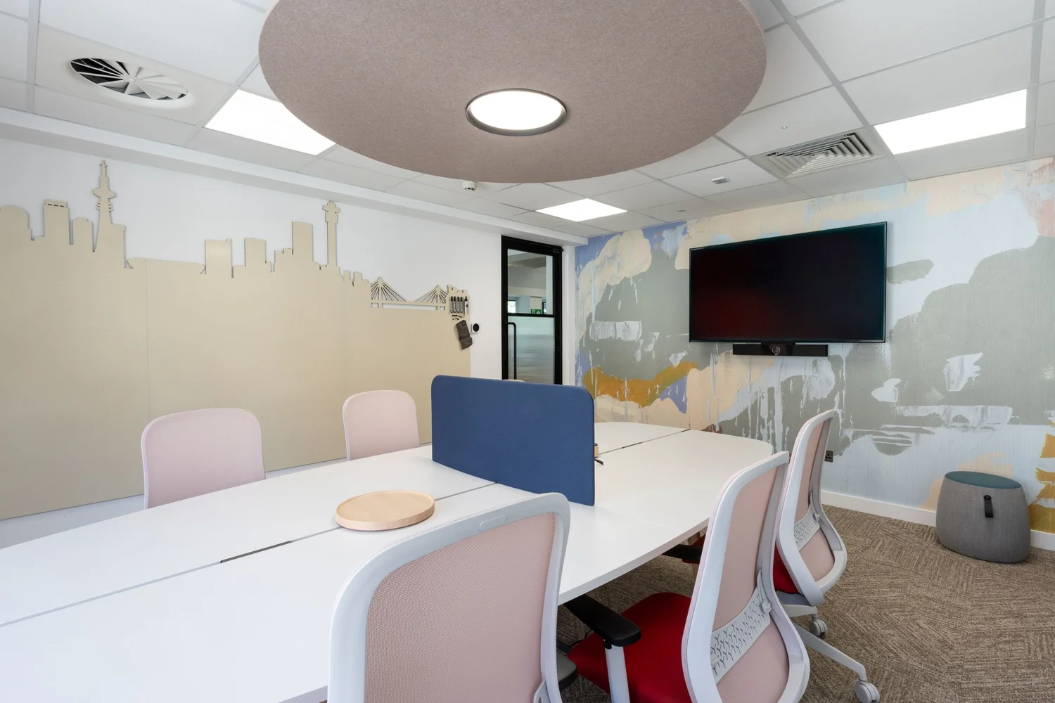 An enclosed meeting room with acoustic ceiling panels at FNB.