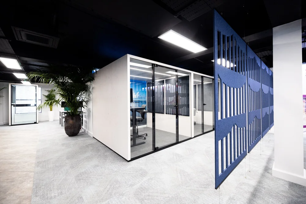 Acoustic meeting pods alongside circulation space