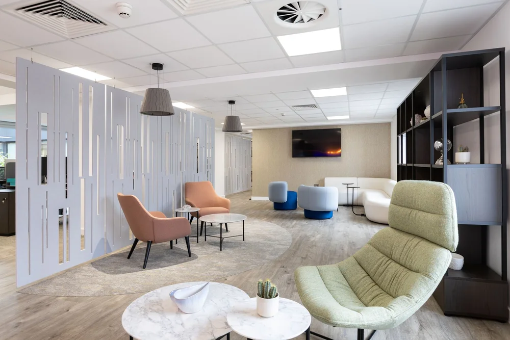 FNB lounge with curved seating, acoustic screens and a view through to the coffee bar