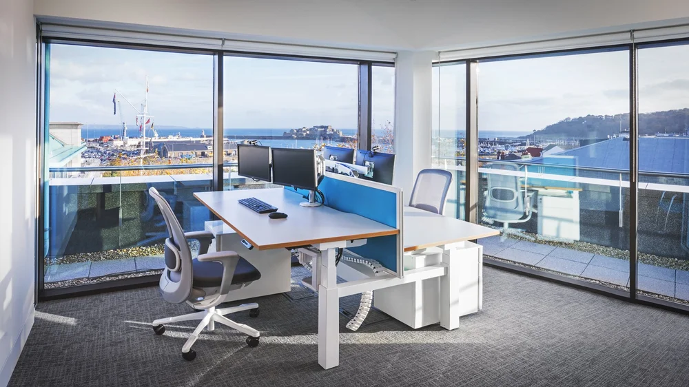 Window-side workstations overlooking St Peter Port