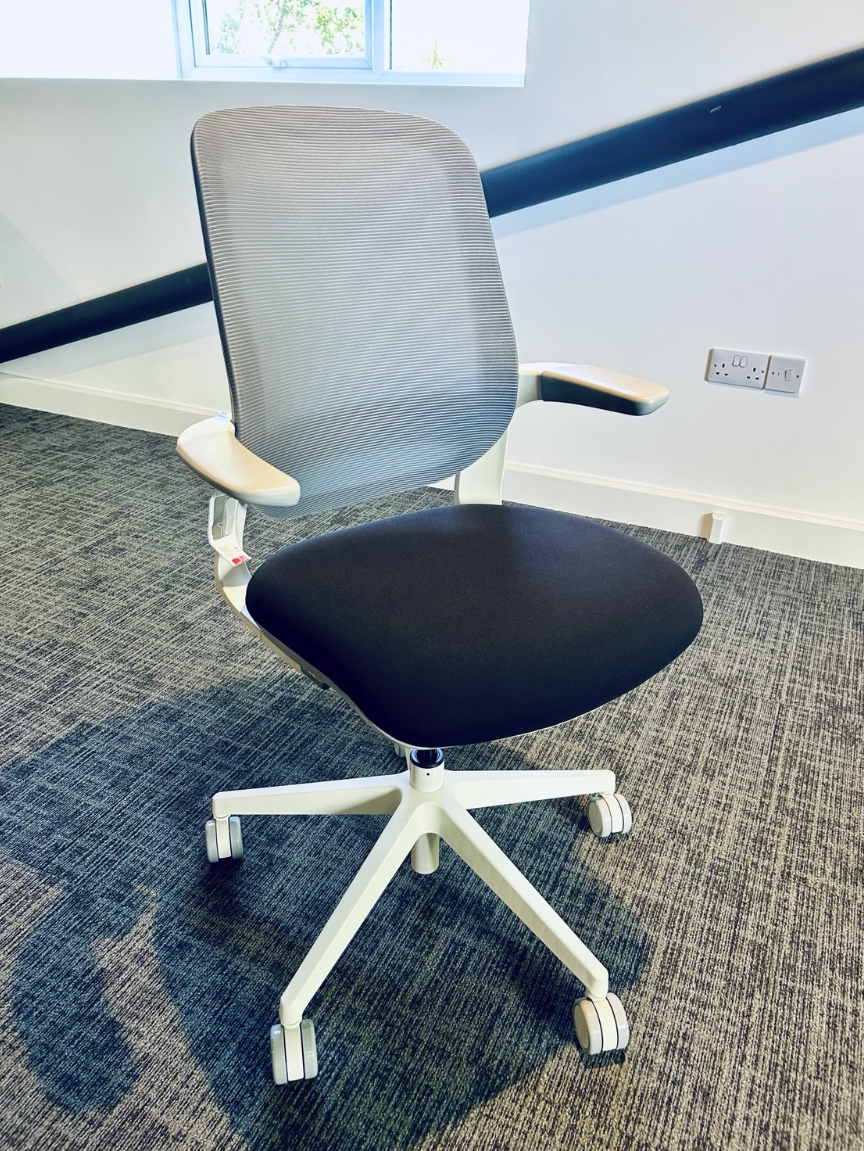 SIDIZ Flight chair with grey mesh back and white frame, actual sale item
