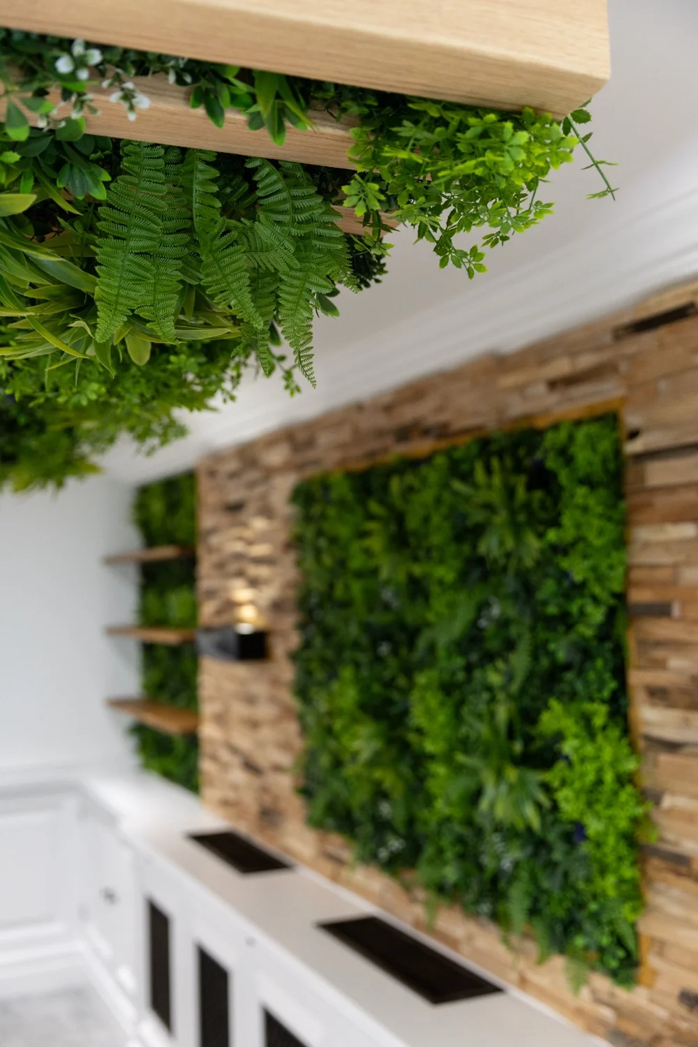 Close view of ceiling beams, planted panels and timber finishes