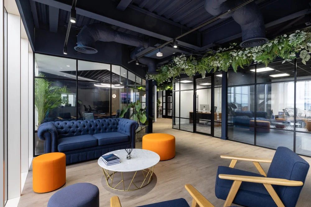 White Star Capital lounge with blue seating and glazed offices
