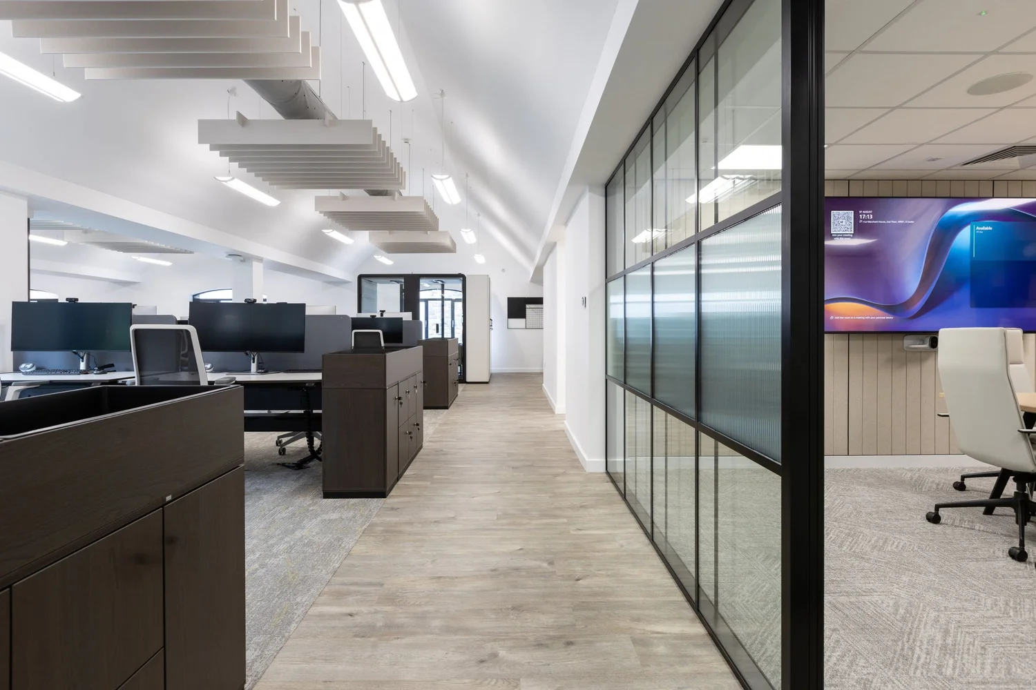 Open workstations alongside enclosed meeting rooms at FNB, Le Marchant House.