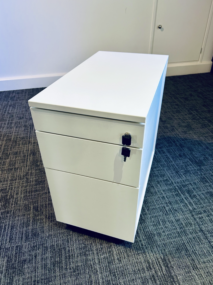 White three-drawer mobile pedestal with keys, actual sale item