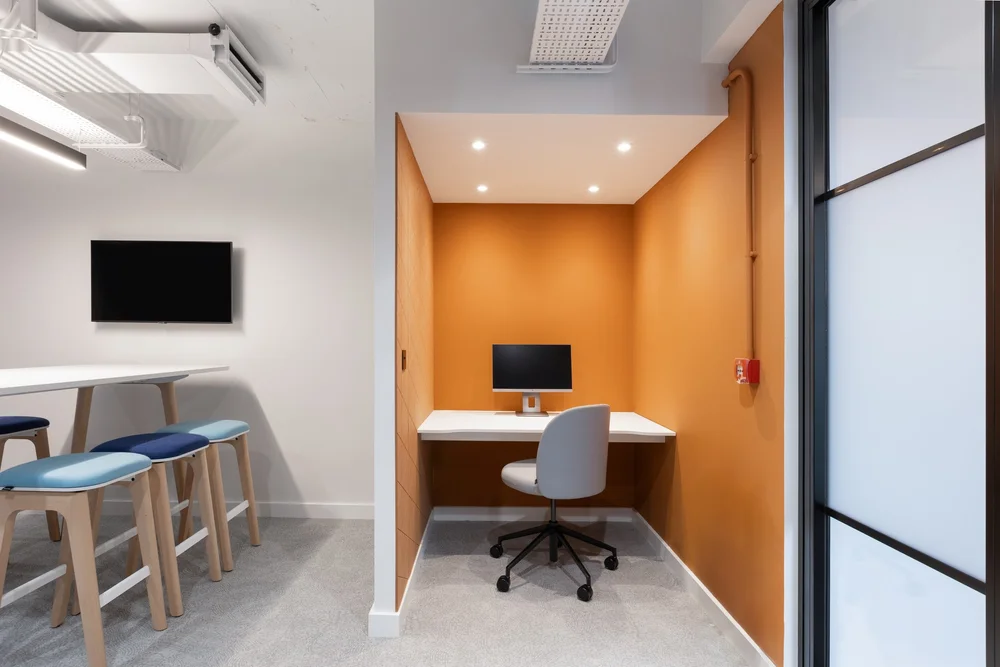 Quiet focus nook beside the glazed meeting pod