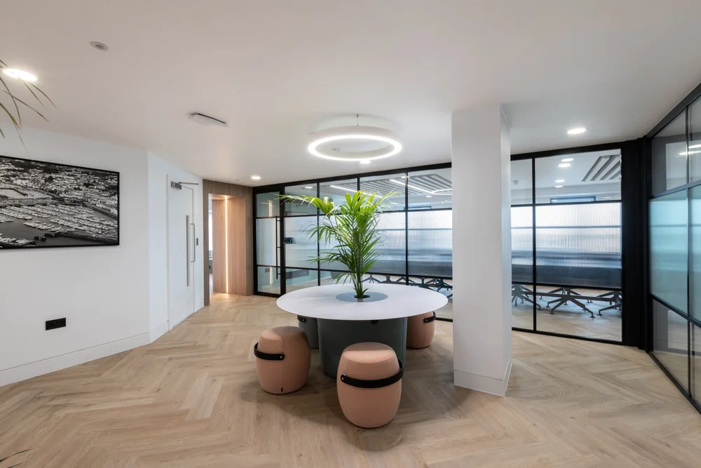 Shared seating area adjoining glazed meeting rooms