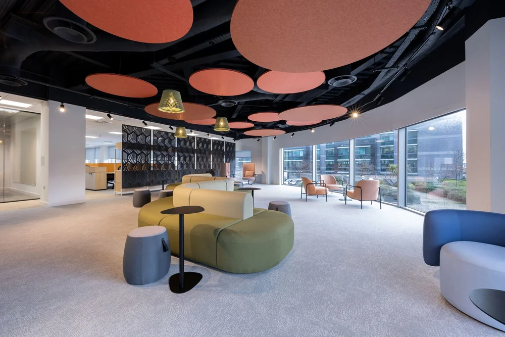 Suntera’s collaboration hub beside the curved windows at Plaza House