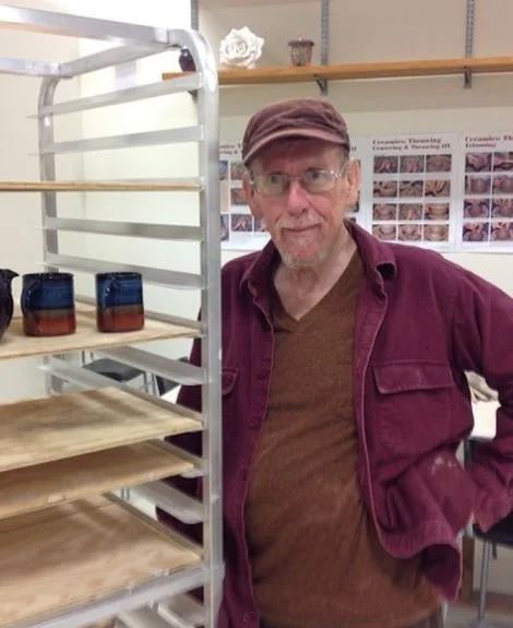 Eddie standing near a cart