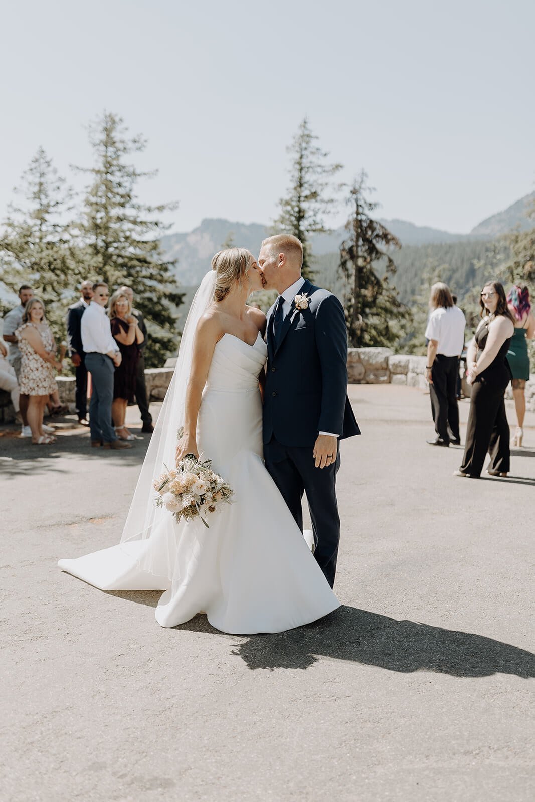 Bride and groom kissing at Mount Rainier destination wedding elopement