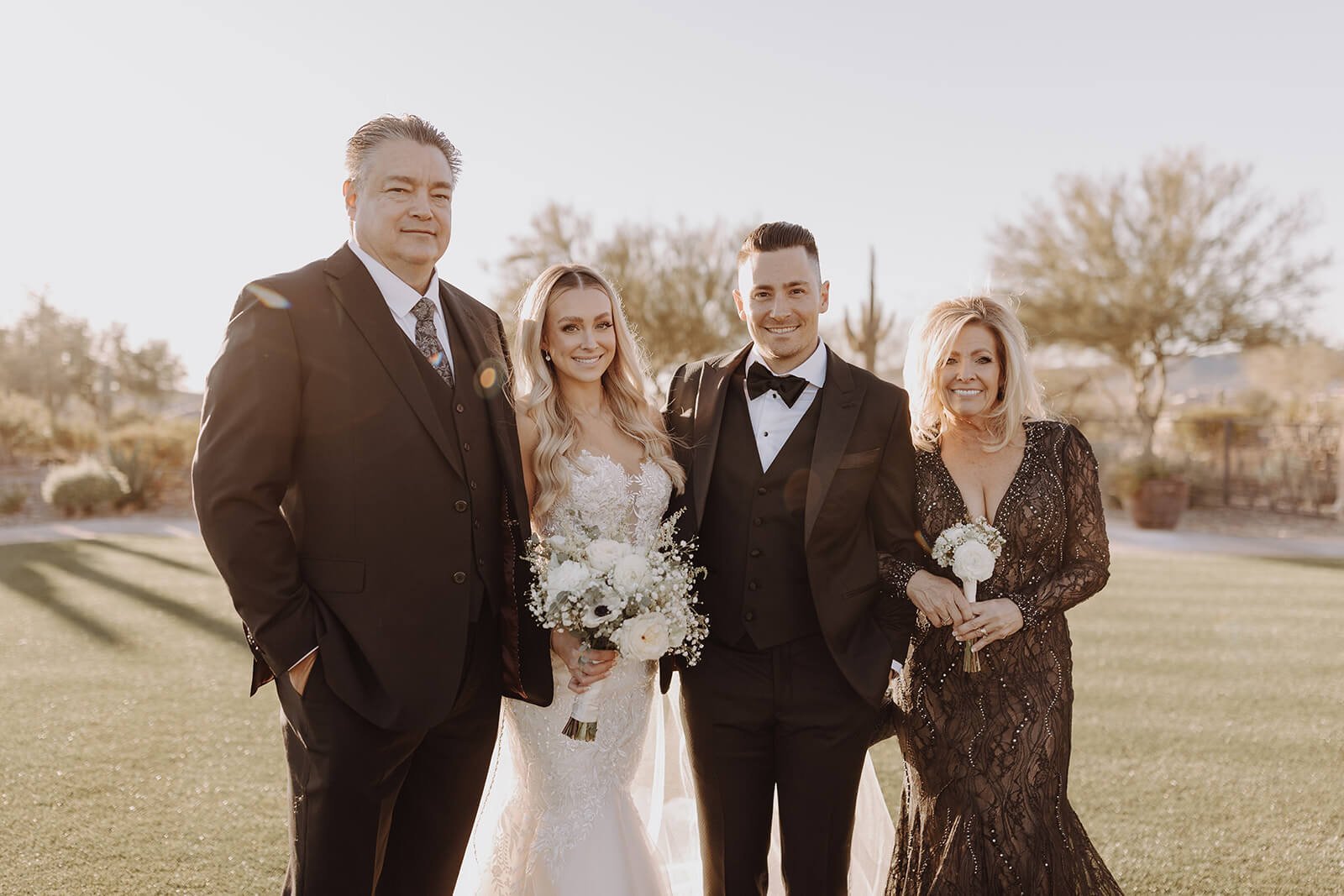 Bride and groom with their family on the lawn at Blackstone Country Club wedding