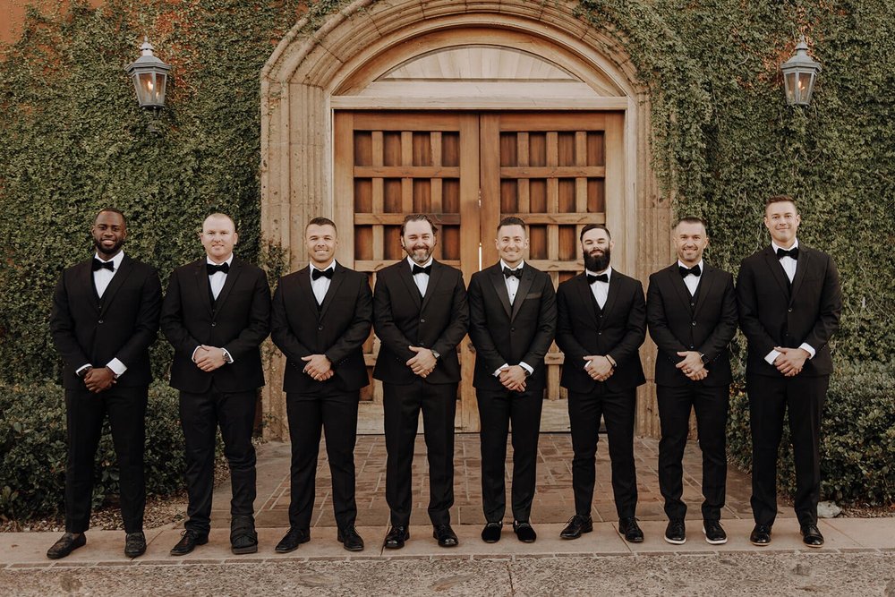 Groom and groomsmen at classy black and white Arizona wedding