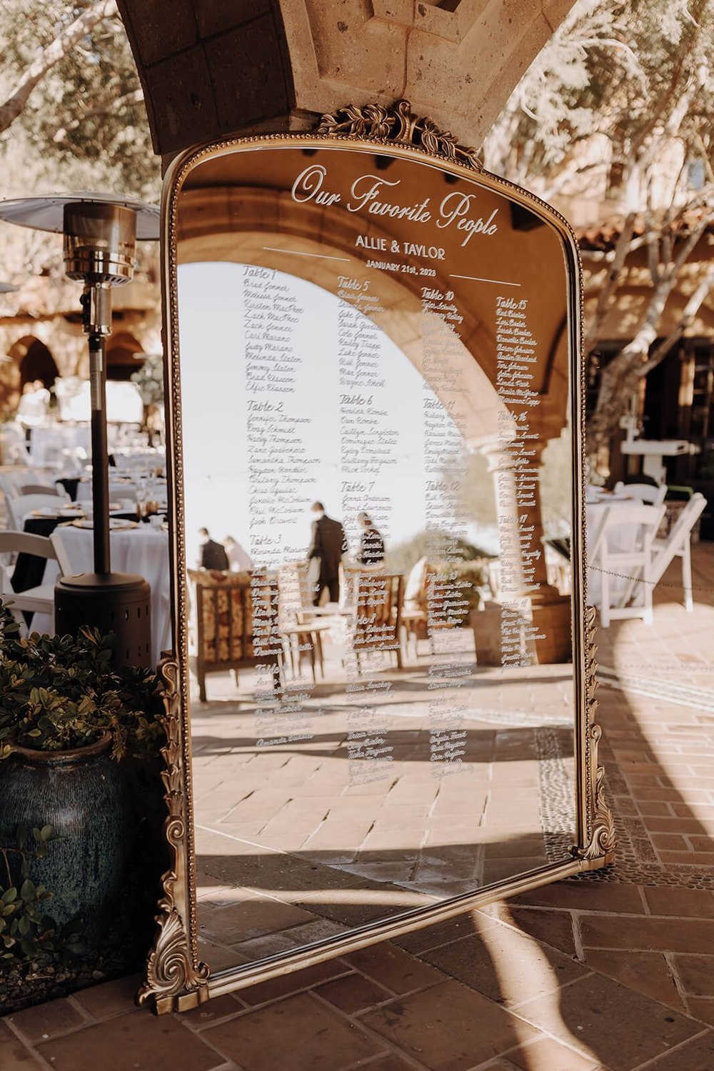 Ornate gold mirror with table assignments at Blackstone Country Club wedding