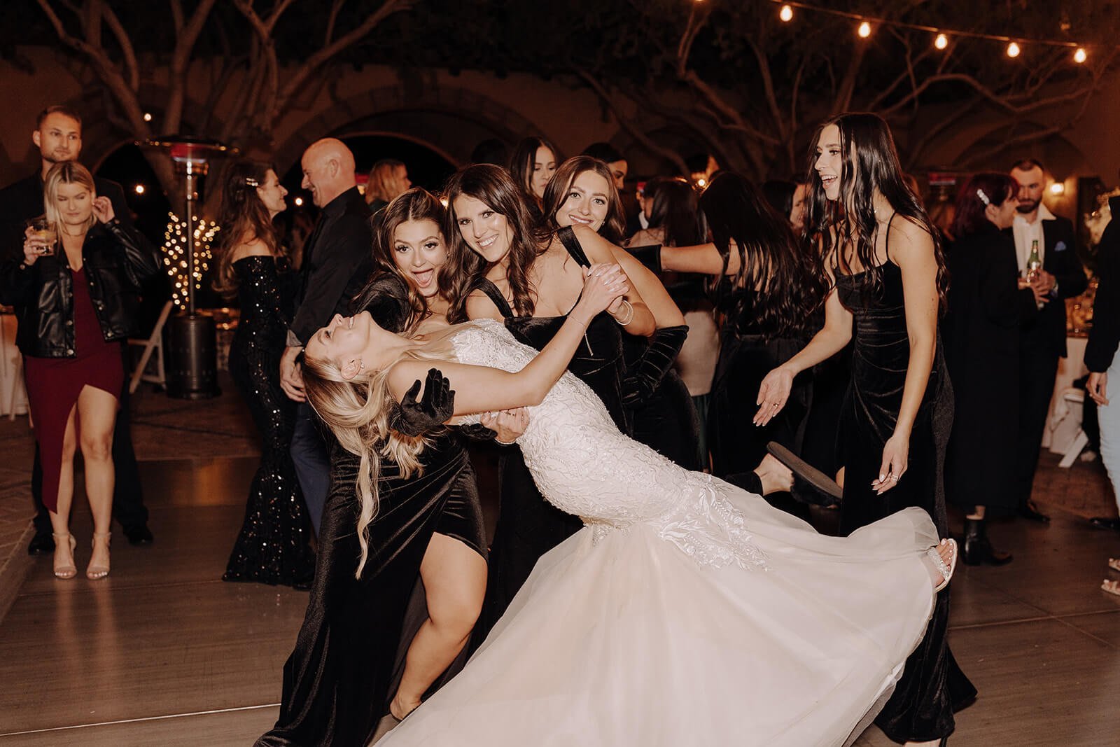 Bridesmaid dipping bride dancing at classy Blackstone Country Club wedding