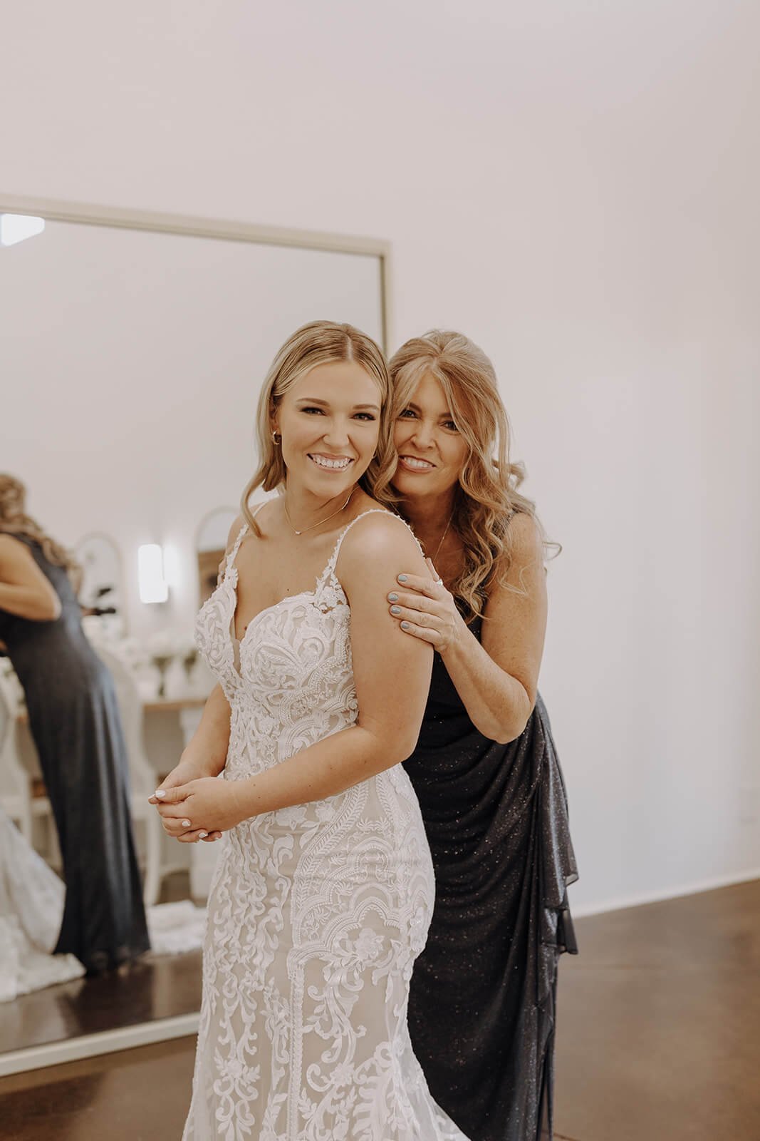 Bride posing with her mother for Arizona destination wedding