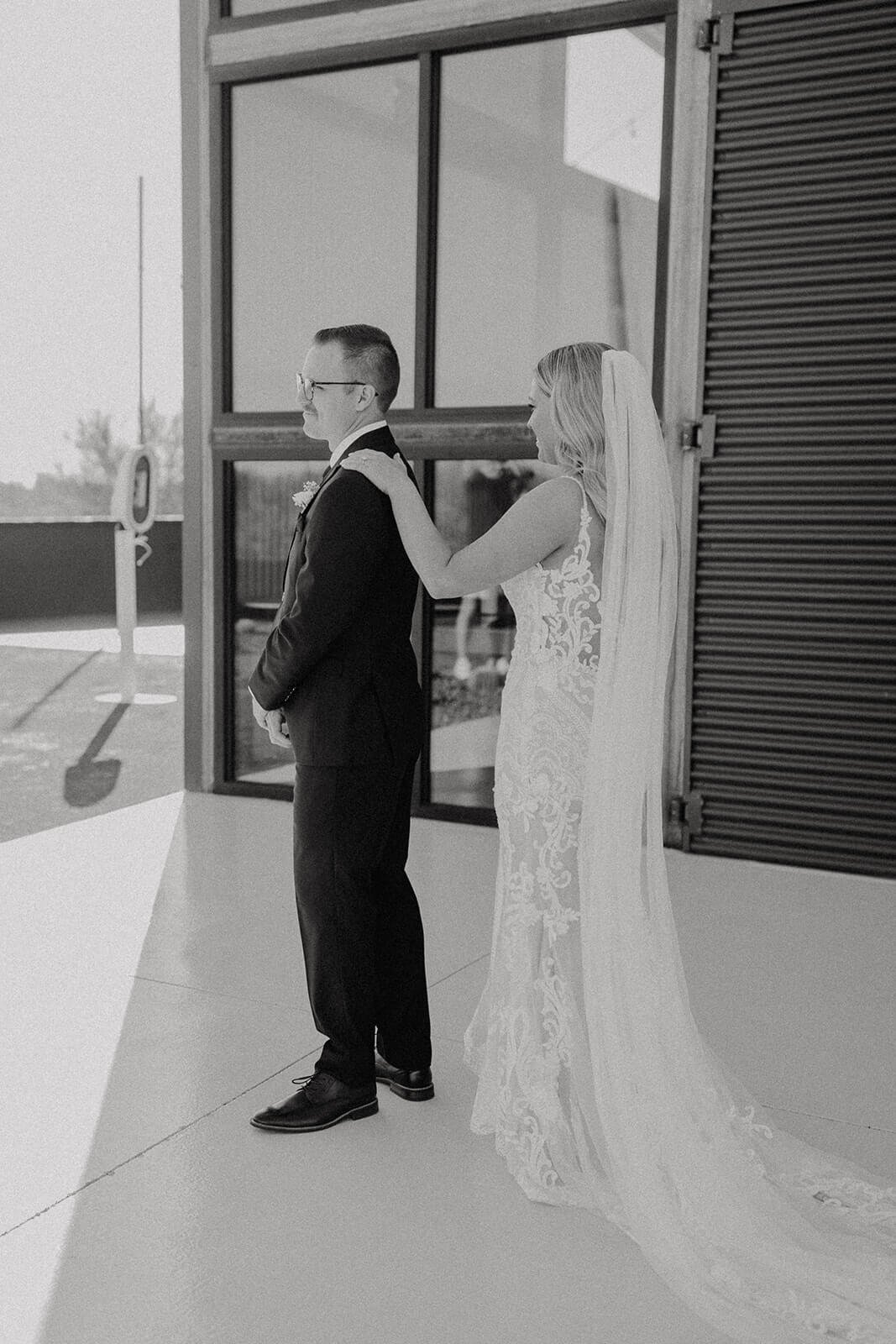 Black and white photo of a bride and groom first look for Arizona destination wedding