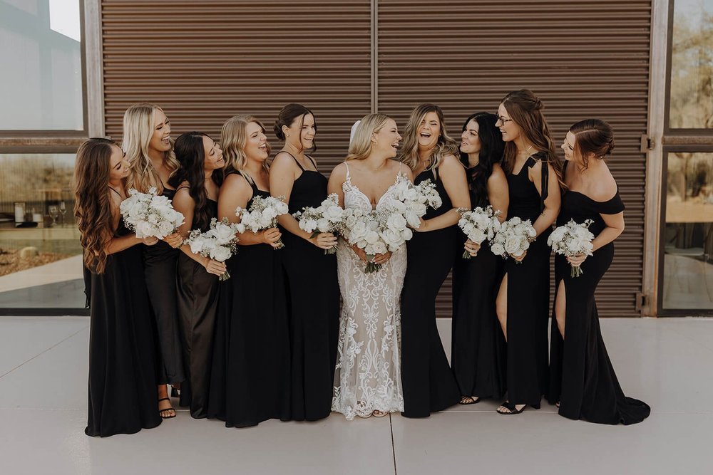 Bride with her bridesmaids outdoors at Arizona destination wedding