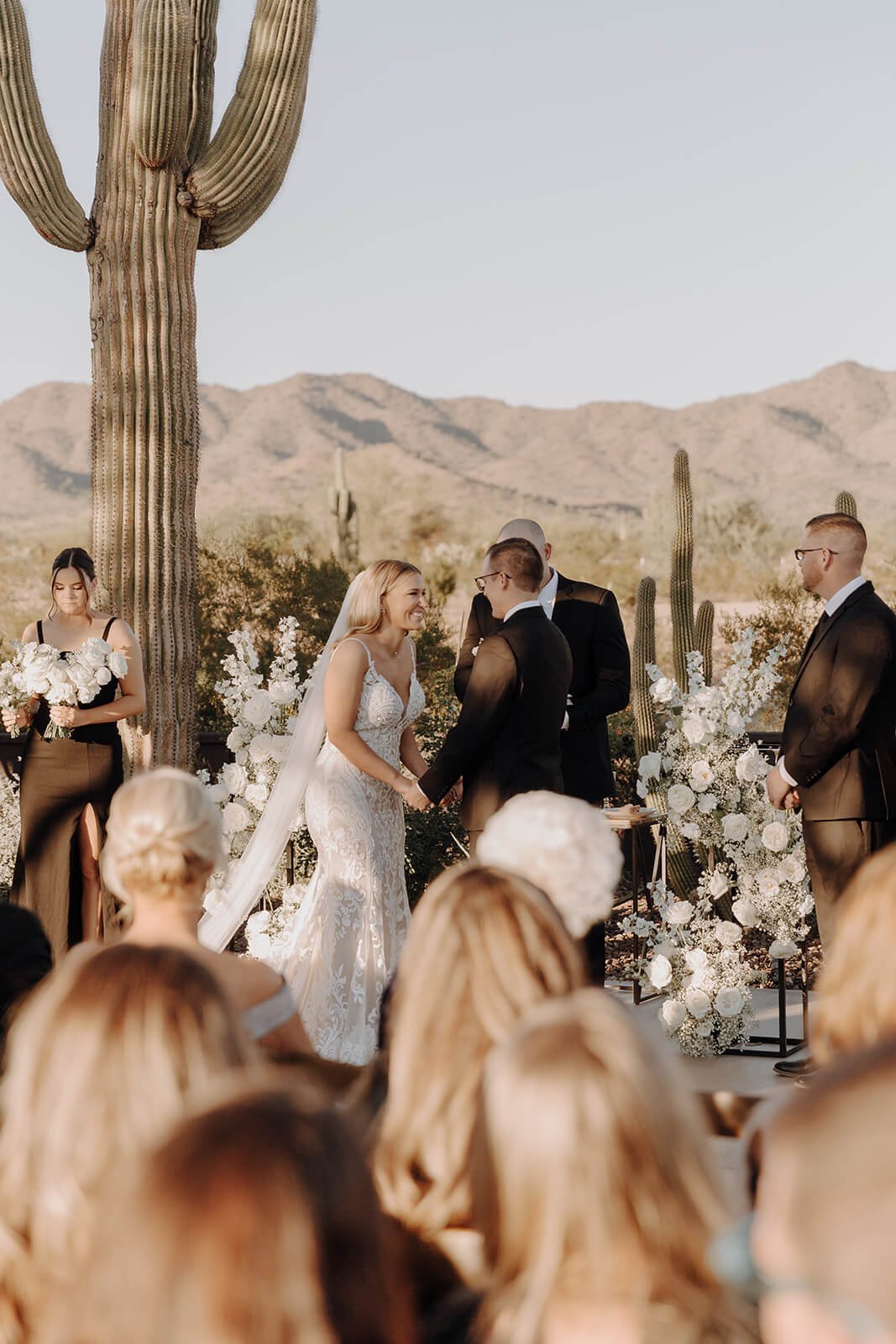 Bride and groom during ceremony outdoors at Arizona destination wedding
