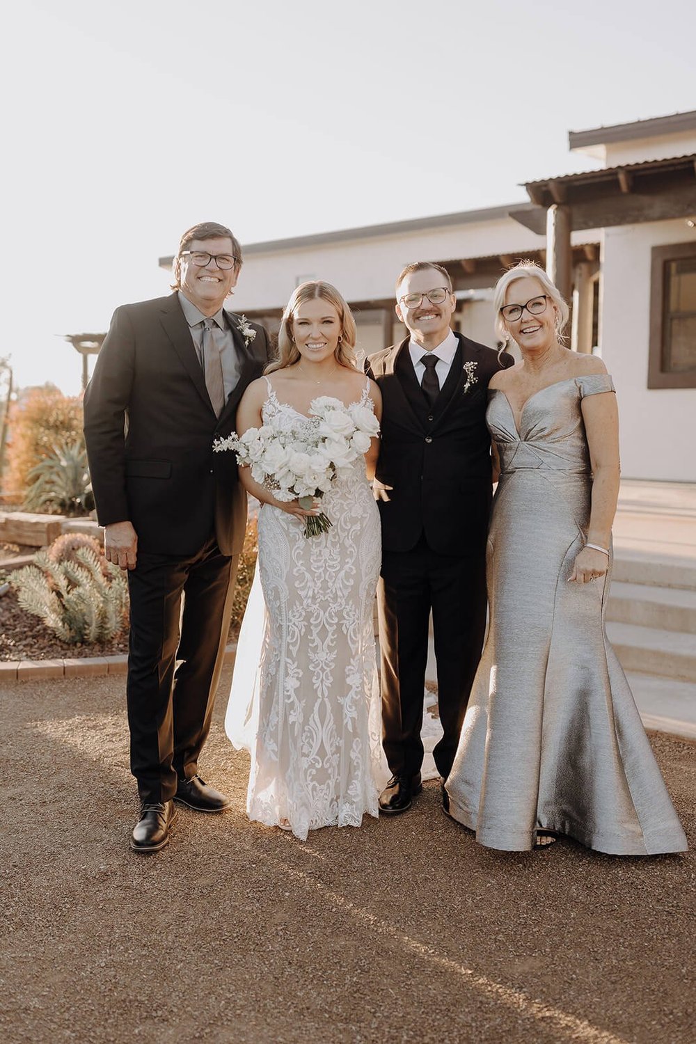 Bride and groom with their parents at Arizona destination wedding