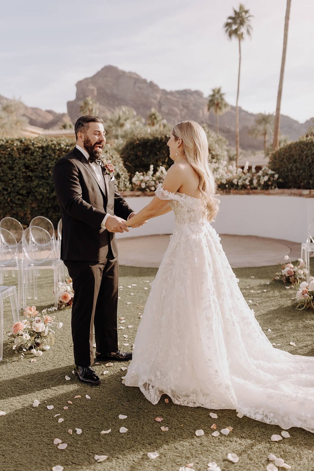 Bride and groom first look outdoors for Scottsdale wedding with mountains in the background