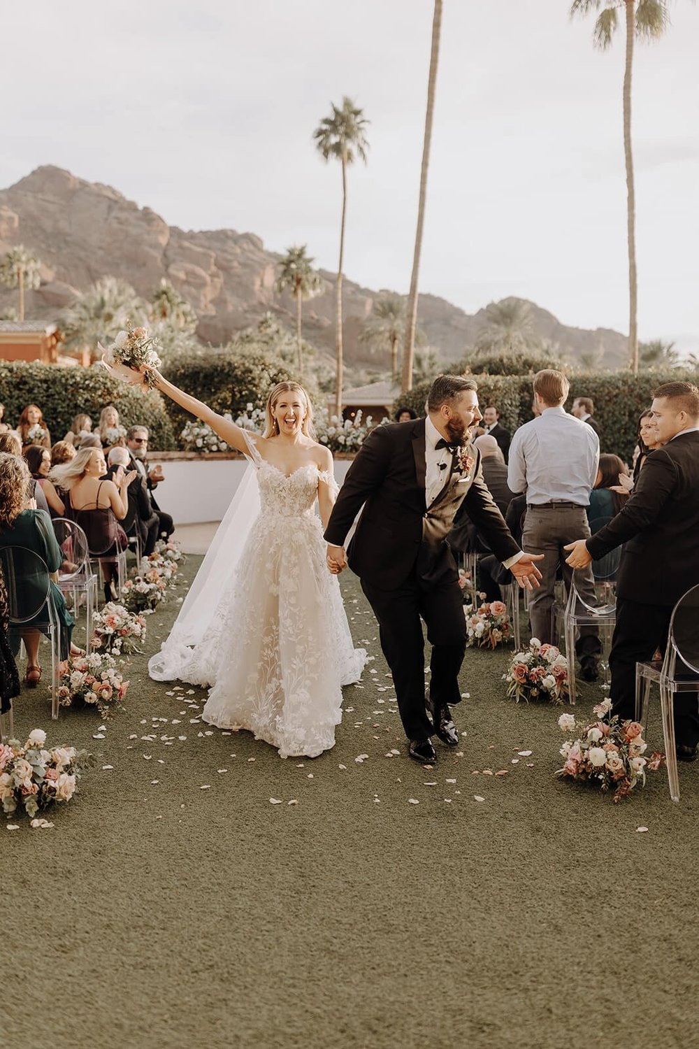 Bride and groom recessional at luxury Scottsdale wedding