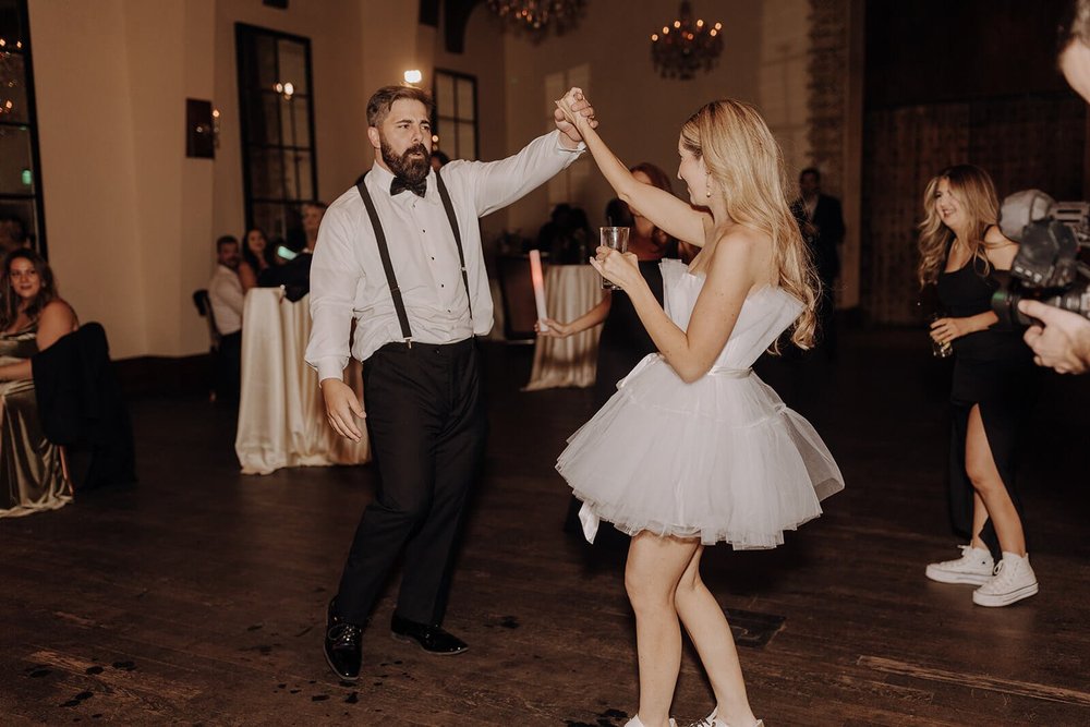 Bride and groom dance at luxury wedding reception