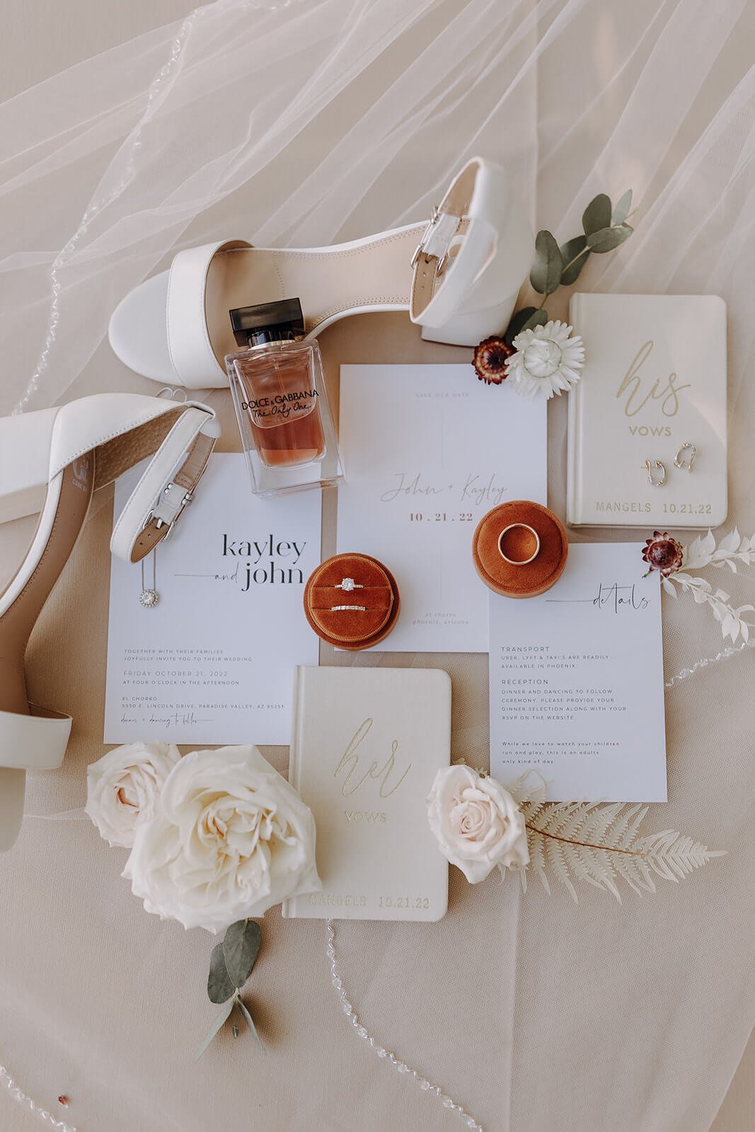 Flat lay wedding invitation, rings, bridal shoes