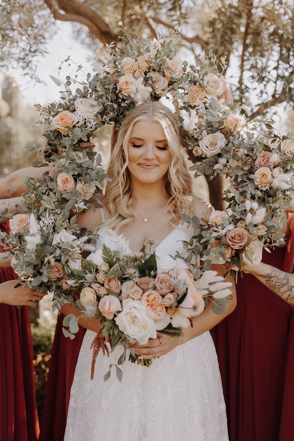 Bride standing with floral wreath