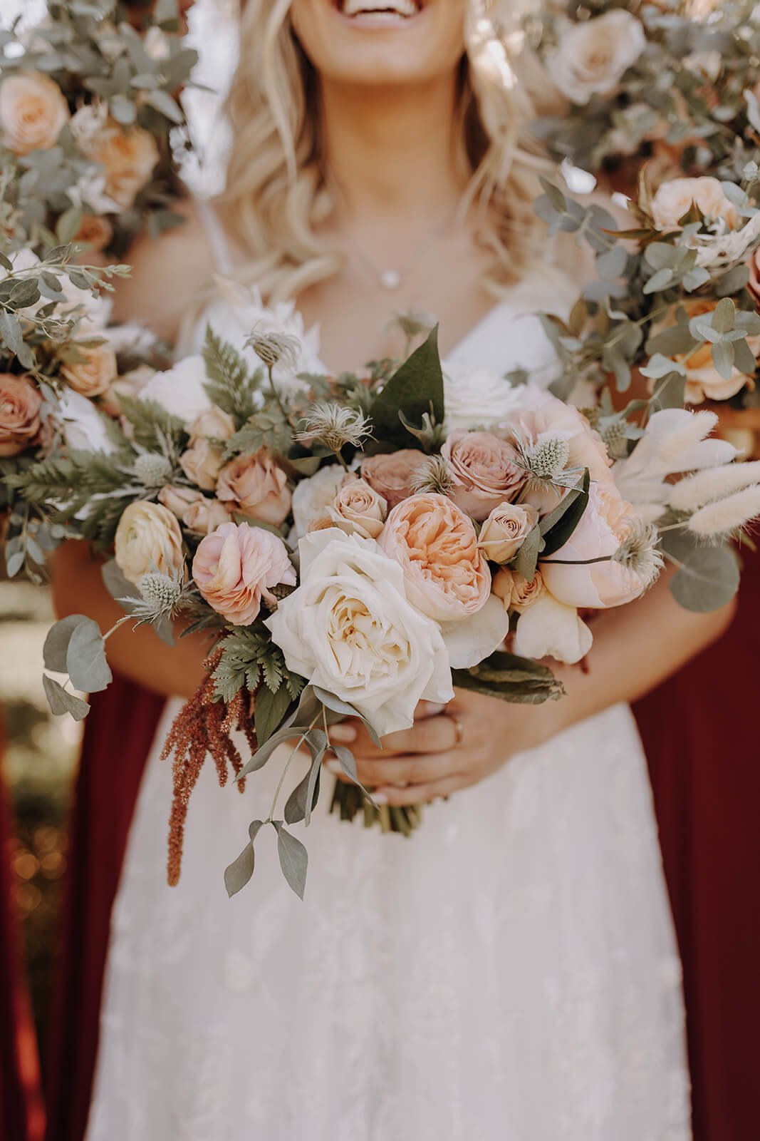 Bride with floral bouquet and floral wreath