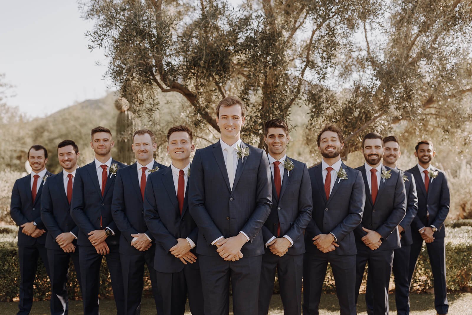 Desert wedding groom with groomsmen