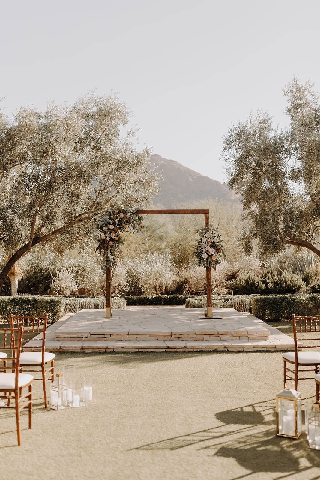 Arizona desert wedding ceremony arbor with mountains in the background