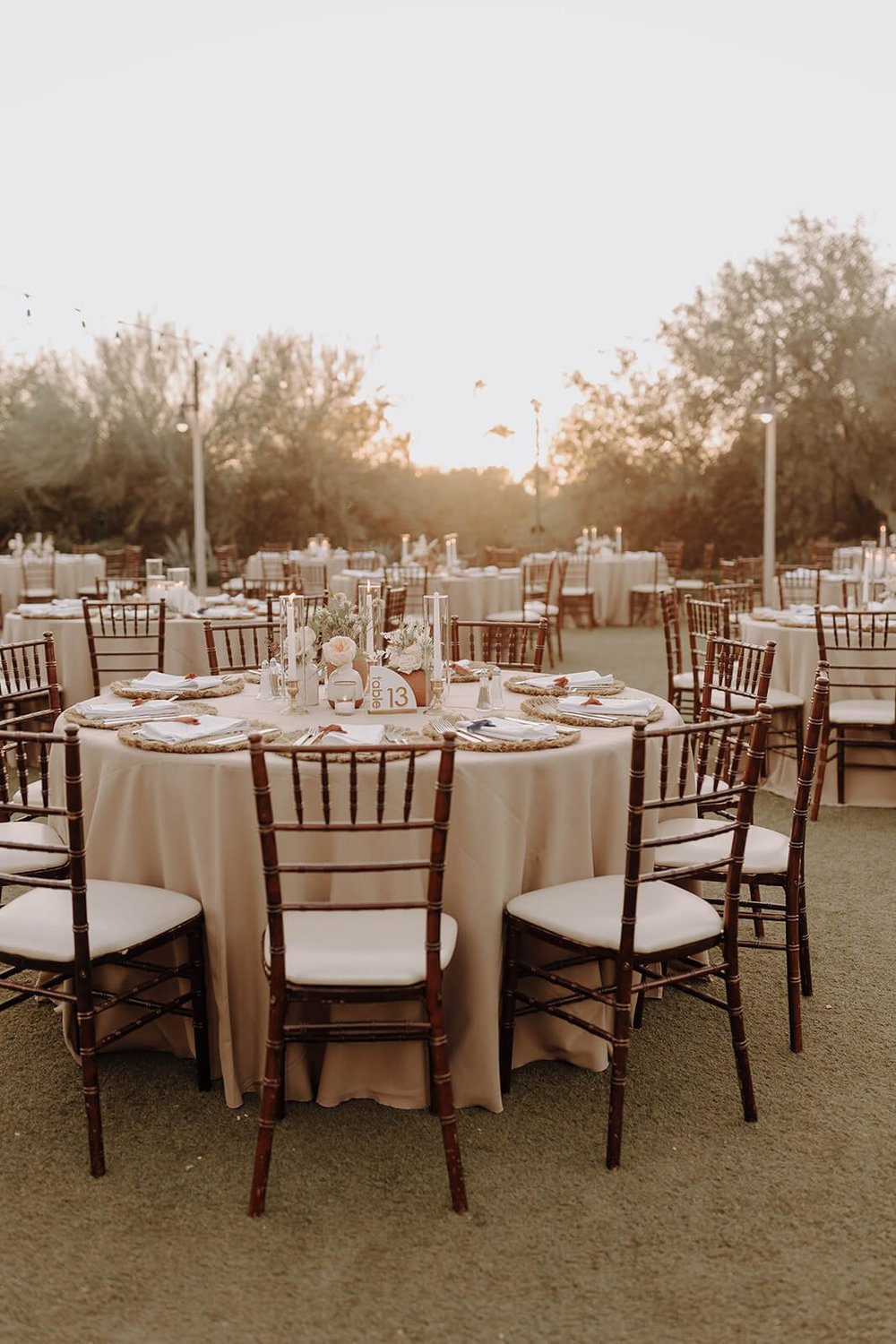 Outdoor desert wedding round tables set for wedding dinner
