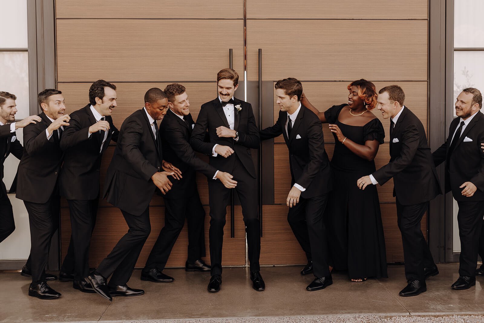 Groomsmen in black suits at Arizona desert wedding