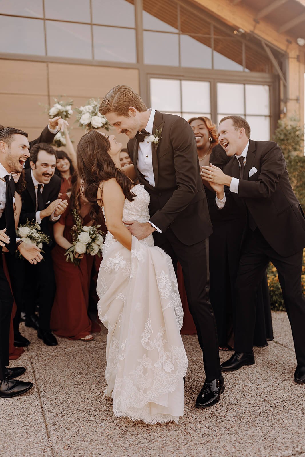 Bride and groom kiss at The Paseo