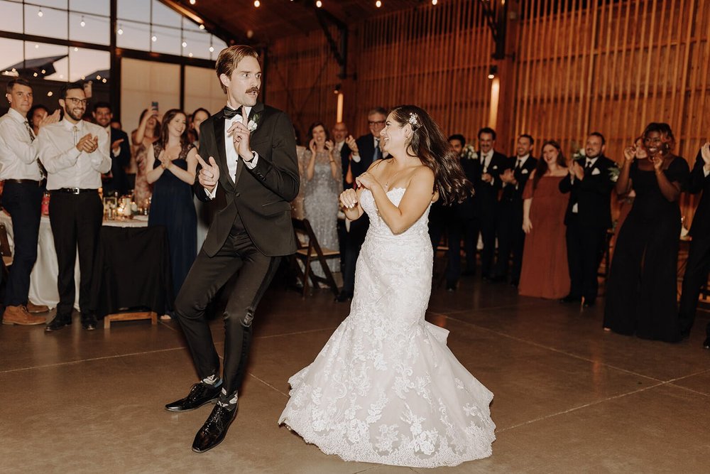 Bride and groom dance on The Paseo wedding venue reception dance floor