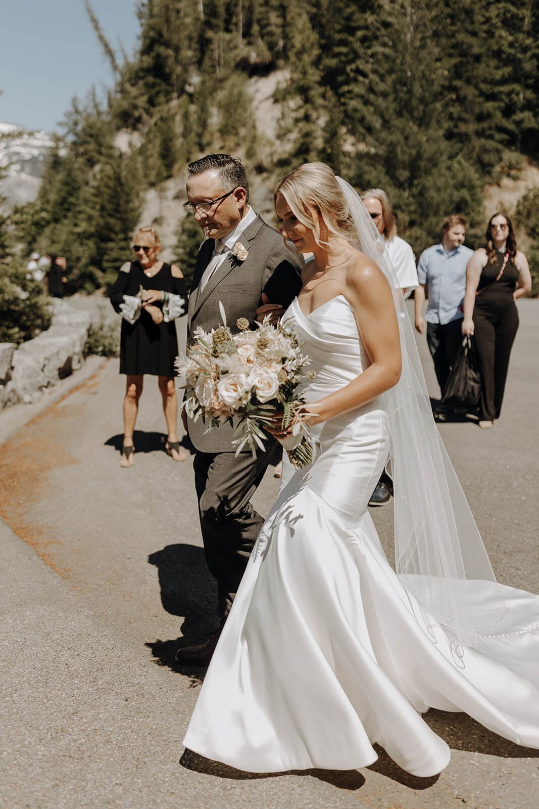 Bride and father walking down the aisle for Mount Rainier wedding