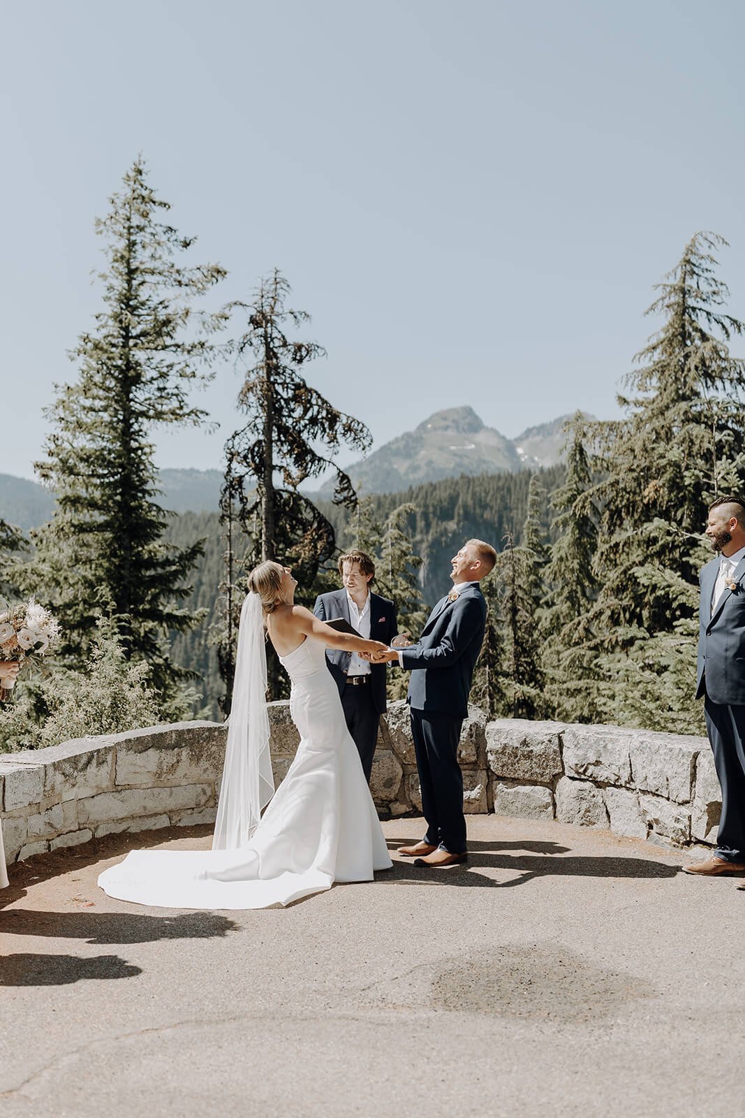 Bride and groom laughing during Mount Rainier wedding ceremony