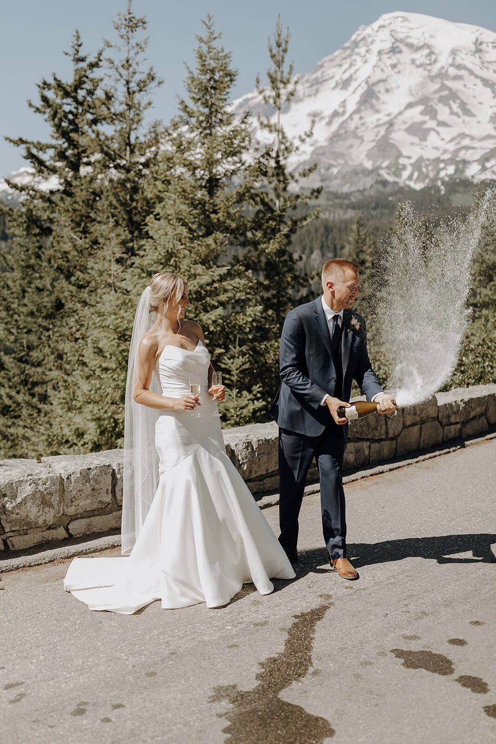 Bride and groom champagne spray at Mount Rainier